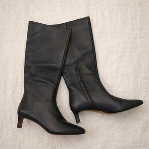 Black leather knee high boots with pointed toe and kitten heel